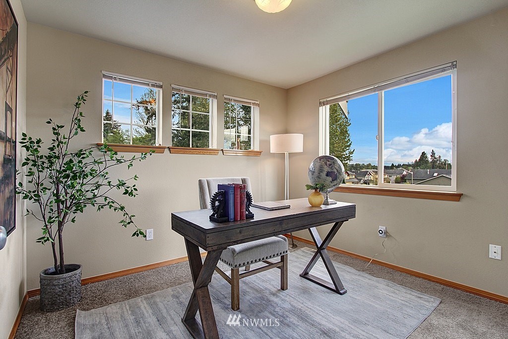 503 Ilwaco Avenue Northeast Renton, WA 98059 - Photo 12 of 17 a view of a workspace room with furniture and window