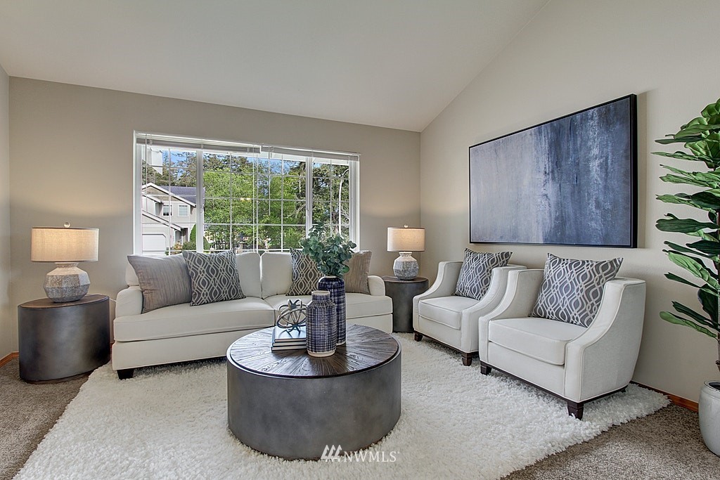 503 Ilwaco Avenue Northeast Renton, WA 98059 - Photo 3 of 17 a living room with furniture and a large window
