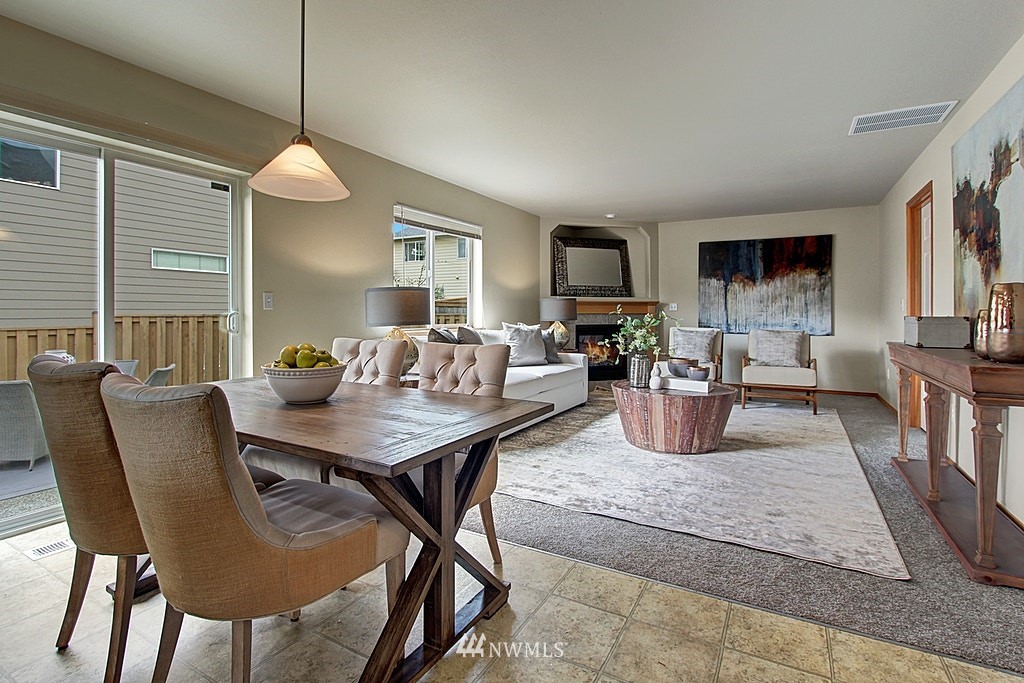 503 Ilwaco Avenue Northeast Renton, WA 98059 - Photo 8 of 17 a view of a dining room with furniture