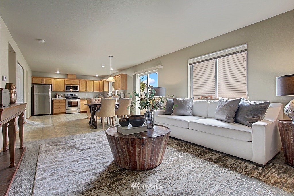 503 Ilwaco Avenue Northeast Renton, WA 98059 - Photo 9 of 17 a living room with furniture and a large window