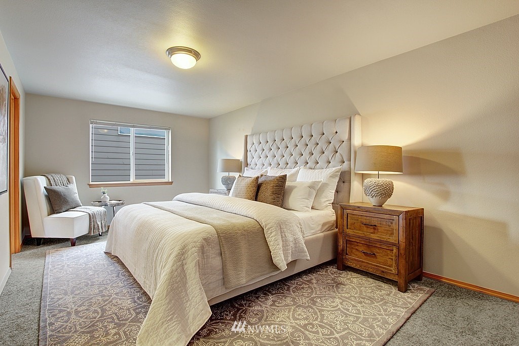 503 Ilwaco Avenue Northeast Renton, WA 98059 - Photo 10 of 17 a bedroom with a bed and window