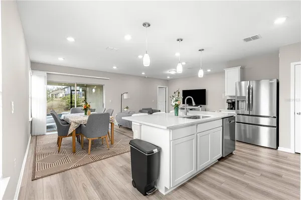 a kitchen with a sink and refrigerator