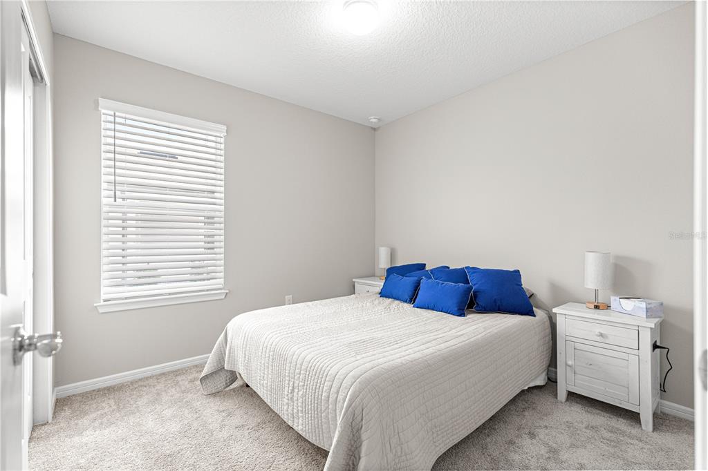 5466 Southwest 85th Ave Road Ocala, FL 34481 - Photo 21 of 36 a bedroom with a bed and a window