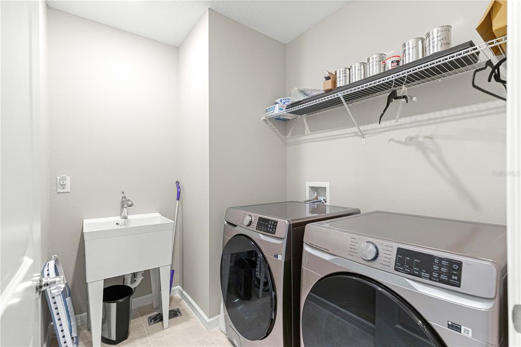 5466 Southwest 85th Ave Road Ocala, FL 34481 - Photo 23 of 36 a utility room with dryer and washer