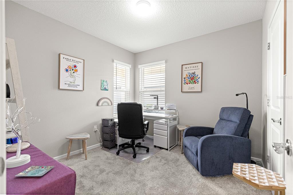 5466 Southwest 85th Ave Road Ocala, FL 34481 - Photo 25 of 36 a living room with furniture and a window