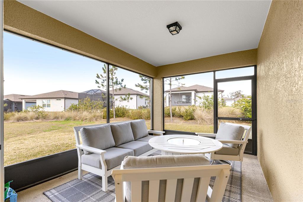 5466 Southwest 85th Ave Road Ocala, FL 34481 - Photo 28 of 36 a bedroom with furniture and large windows