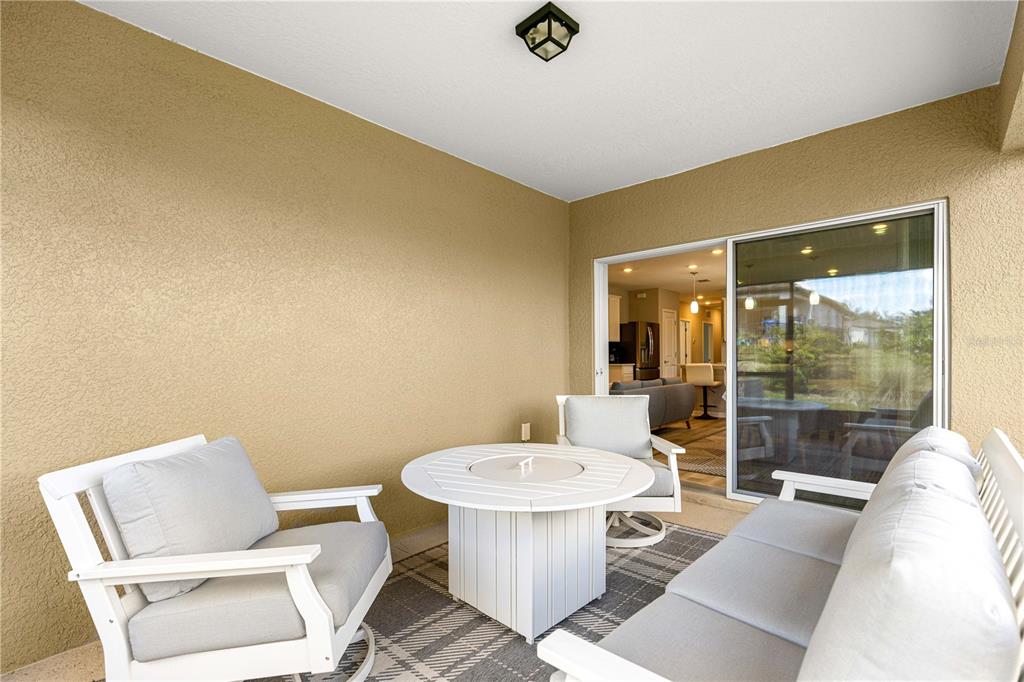 5466 Southwest 85th Ave Road Ocala, FL 34481 - Photo 29 of 36 a living room with a couch and a table