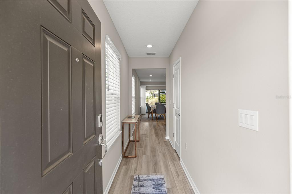 5466 Southwest 85th Ave Road Ocala, FL 34481 - Photo 4 of 36 a view of hallway with wooden floor