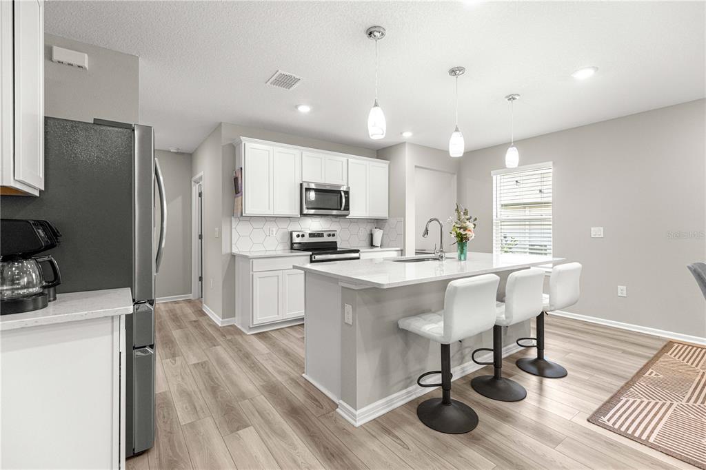 5466 Southwest 85th Ave Road Ocala, FL 34481 - Photo 6 of 36 a kitchen with counter space cabinets and appliances