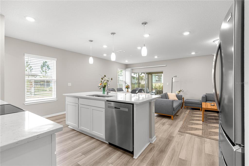 5466 Southwest 85th Ave Road Ocala, FL 34481 - Photo 7 of 36 a large white kitchen with a large window