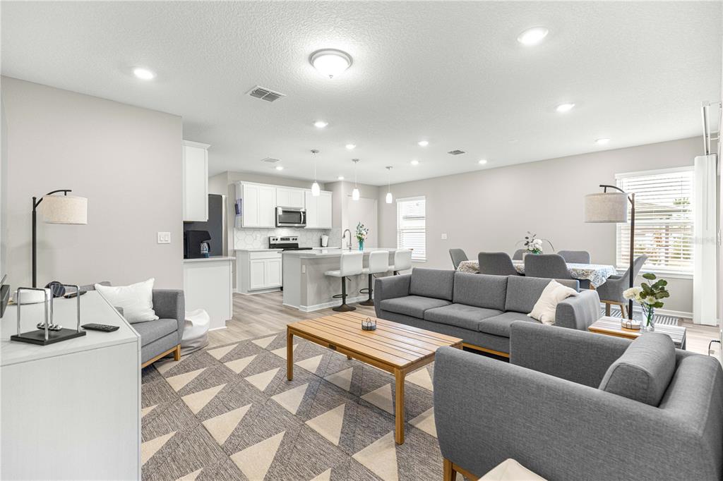5466 Southwest 85th Ave Road Ocala, FL 34481 - Photo 10 of 36 a living room with furniture and view of kitchen