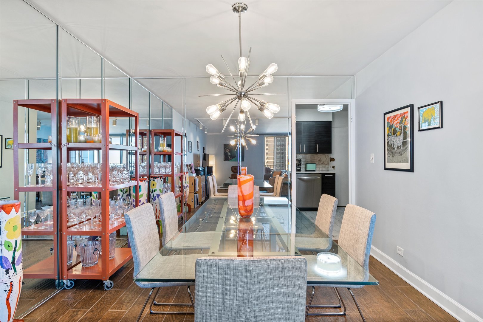 6033 North Sheridan Road, Unit 21D Chicago, IL 60660 - Photo 4 of 22 a view of a dining room with furniture and a chandelier