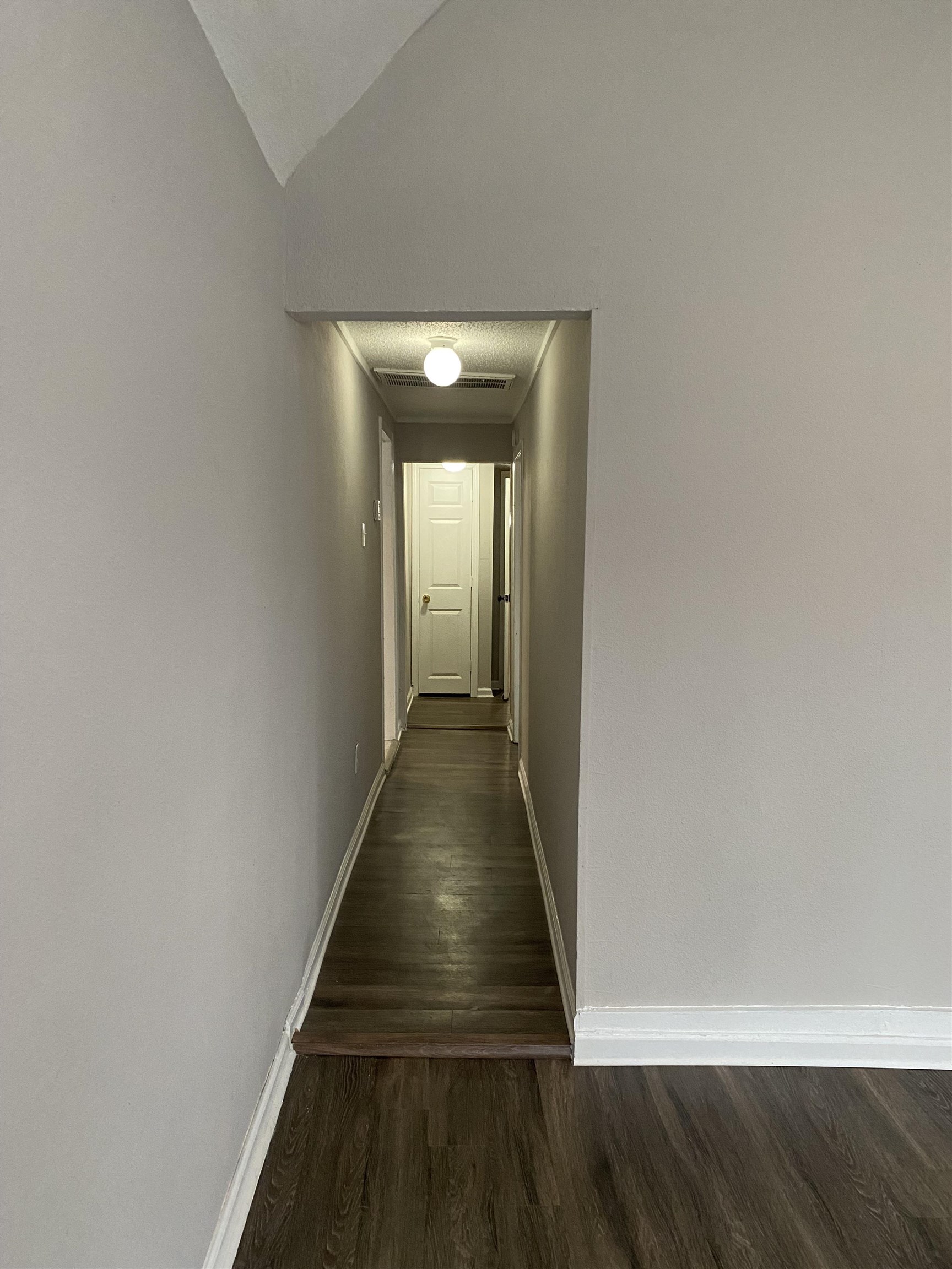 3219 Nathan Avenue Memphis, TN 38112 - Photo 4 of 23 a view of a hallway with wooden floor