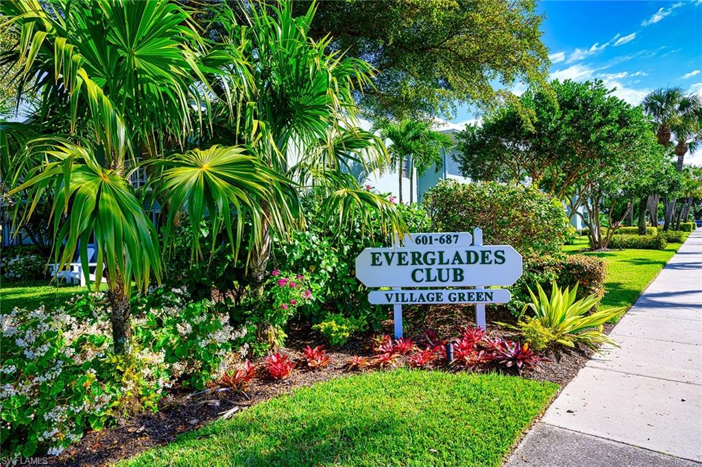 637 12th Avenue South, Unit 637 Naples, FL 34102 - Photo 1 of 35 a view of a sign board with a garden