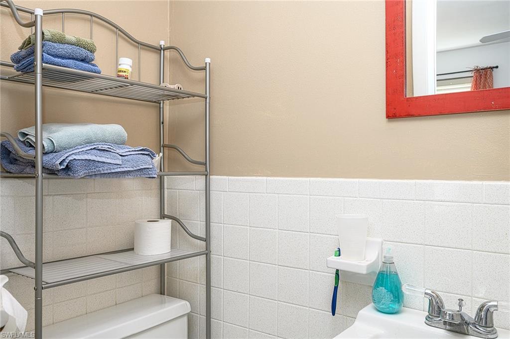 637 12th Avenue South, Unit 637 Naples, FL 34102 - Photo 14 of 35 a bathroom with a sink and a mirror