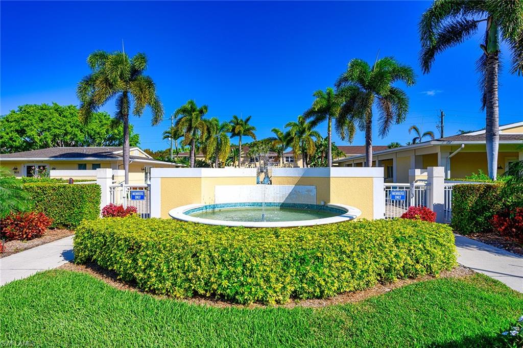 637 12th Avenue South, Unit 637 Naples, FL 34102 - Photo 19 of 35 a view of a house with a yard and potted plants