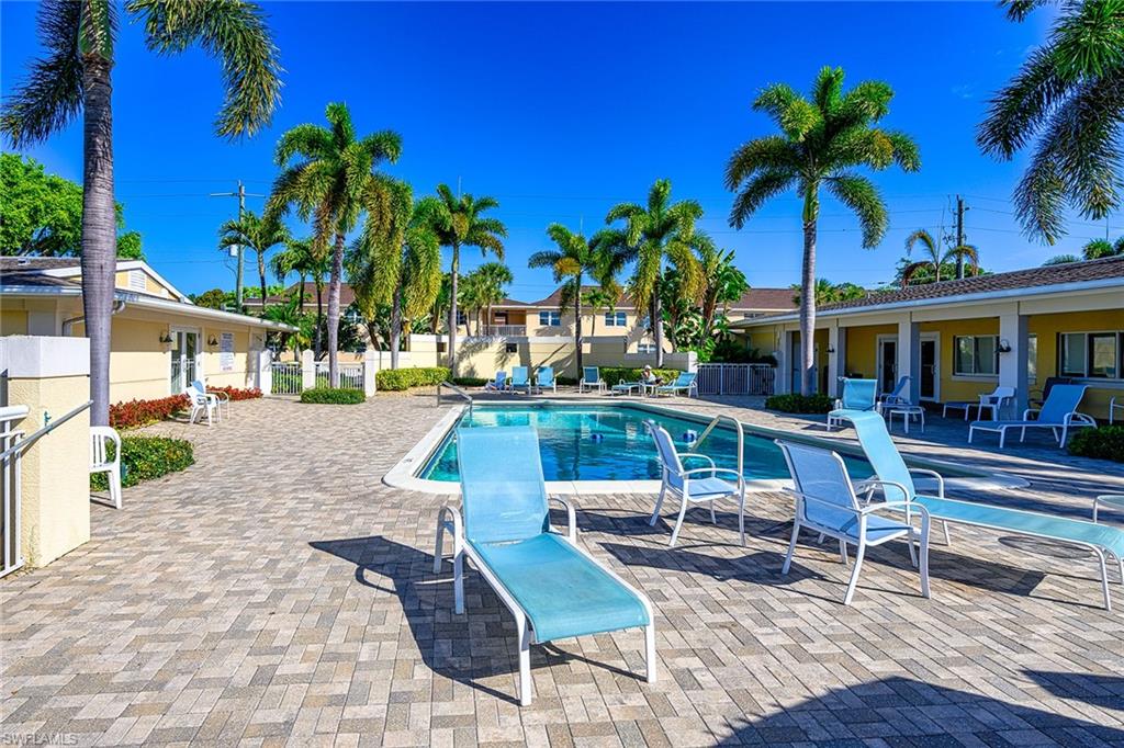 637 12th Avenue South, Unit 637 Naples, FL 34102 - Photo 21 of 35 a view of a house with swimming pool and sitting area