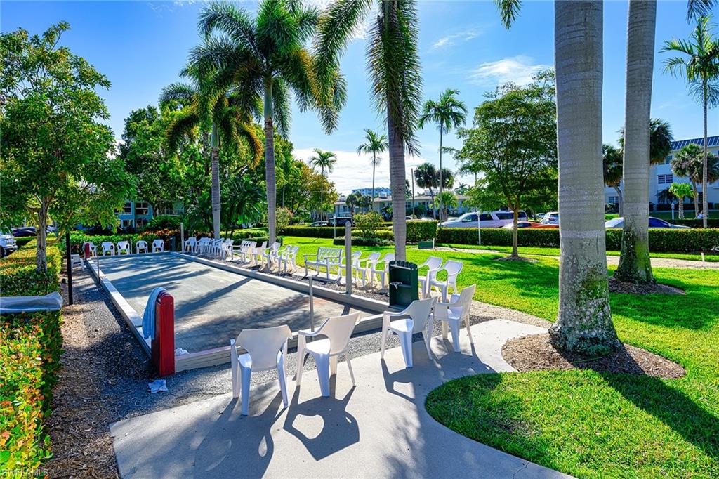 637 12th Avenue South, Unit 637 Naples, FL 34102 - Photo 24 of 35 a view of a backyard with sitting area