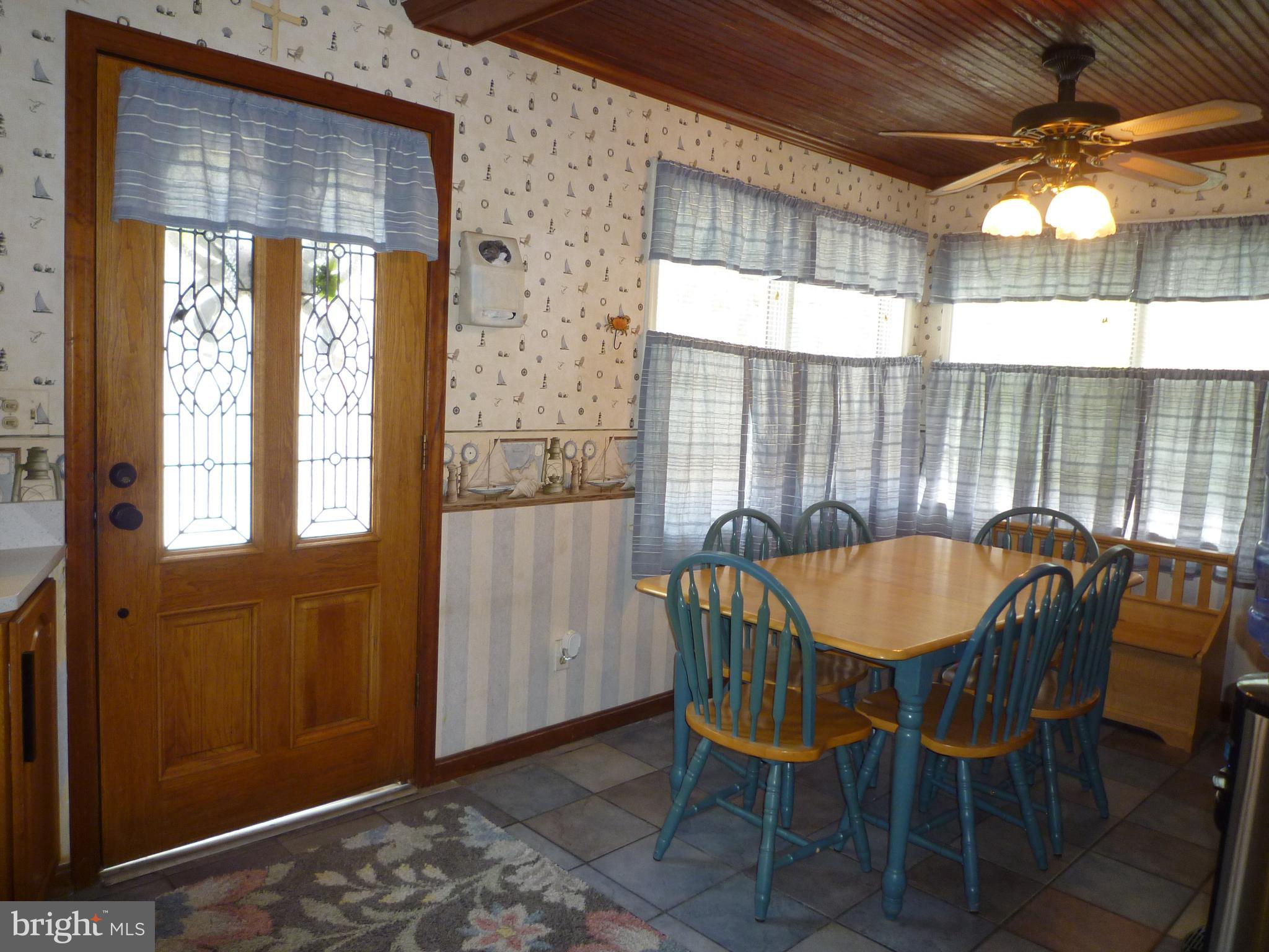 1315 Wildwood Beach Road Essex, MD 21221 - Photo 11 of 56 a view of a dining room with furniture and window
