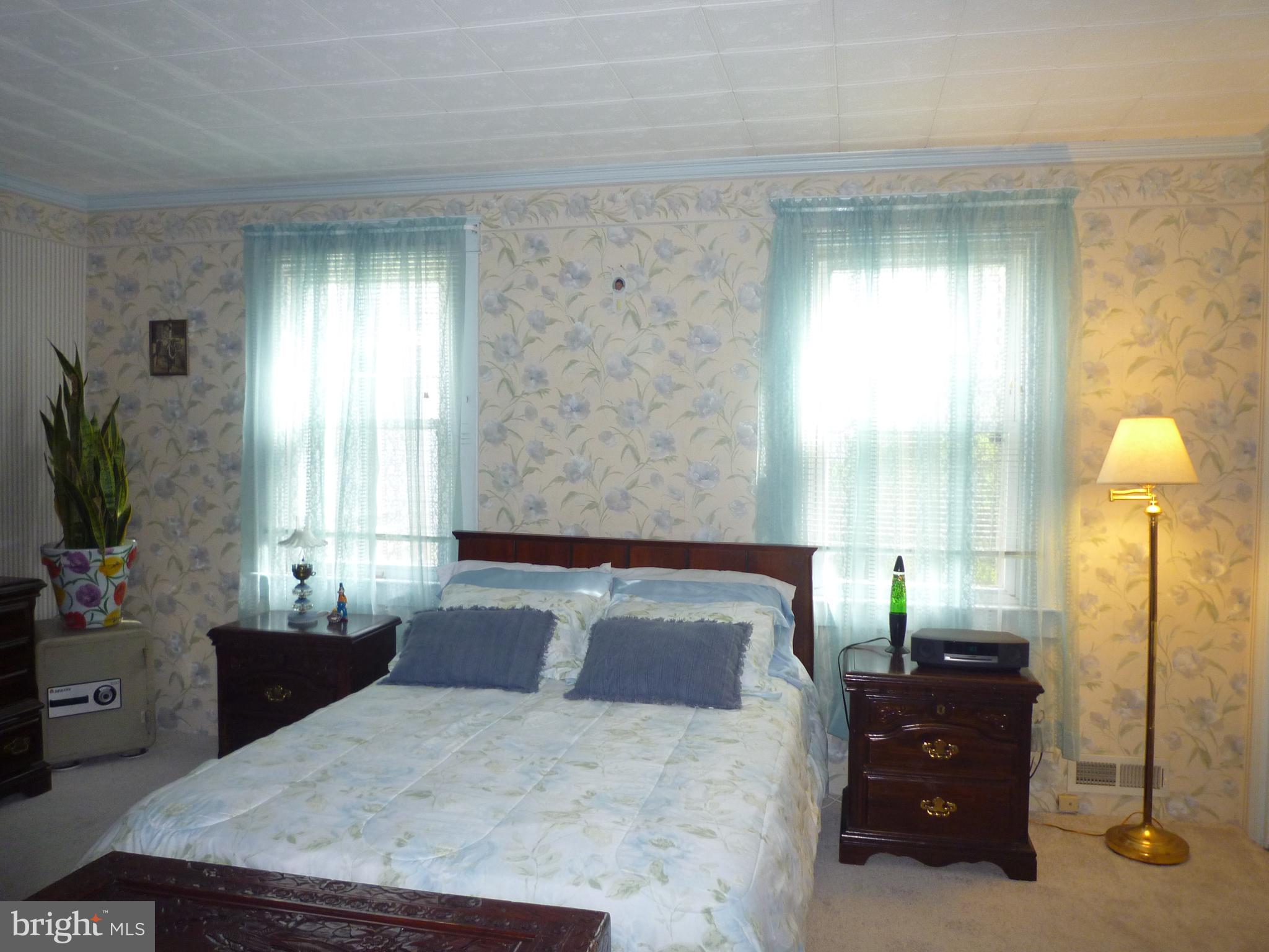 1315 Wildwood Beach Road Essex, MD 21221 - Photo 13 of 56 a bedroom with a bed and window