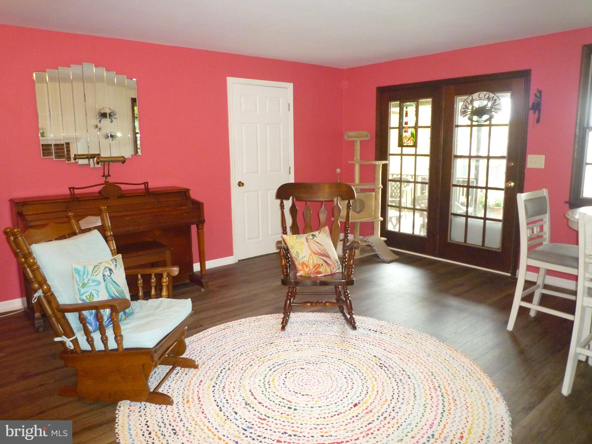 1315 Wildwood Beach Road Essex, MD 21221 - Photo 17 of 56 a living room with furniture and a floor to ceiling window