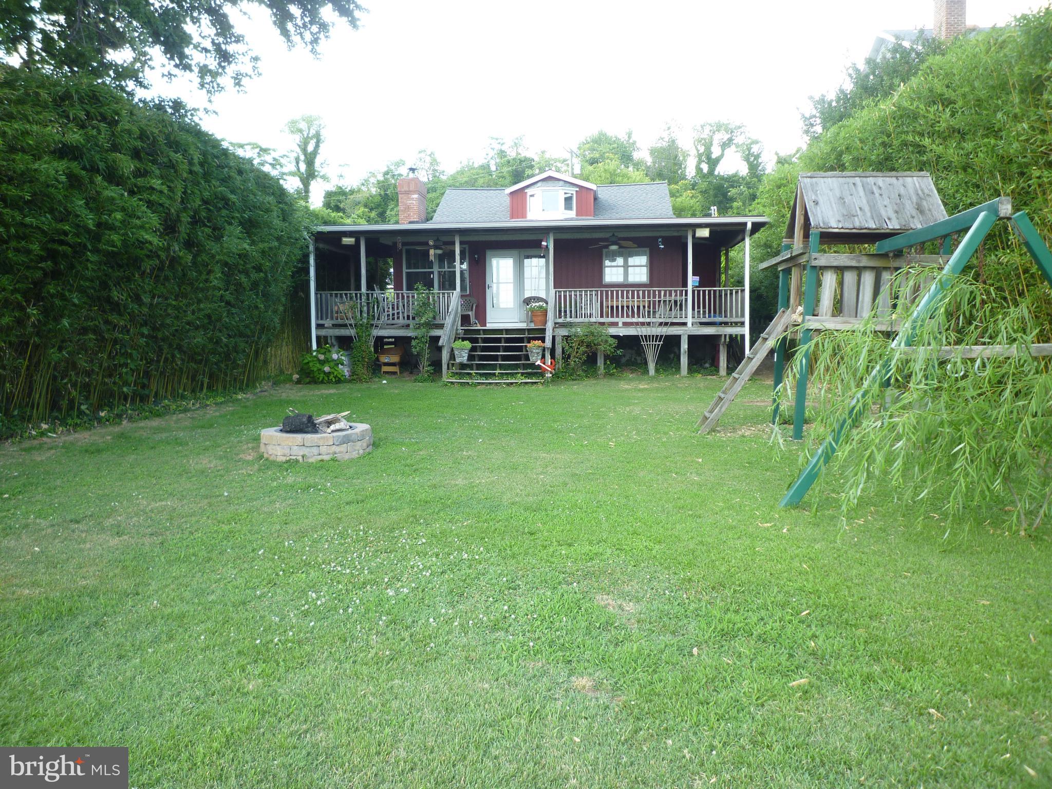 1315 Wildwood Beach Road Essex, MD 21221 - Photo 21 of 56 a view of a house with backyard porch and sitting area