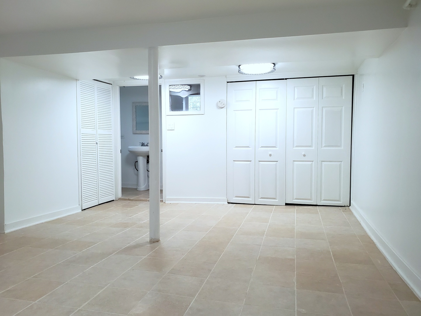 653 East 105th Street Chicago, IL 60628 - Photo 19 of 27 an empty room with closet and wooden door