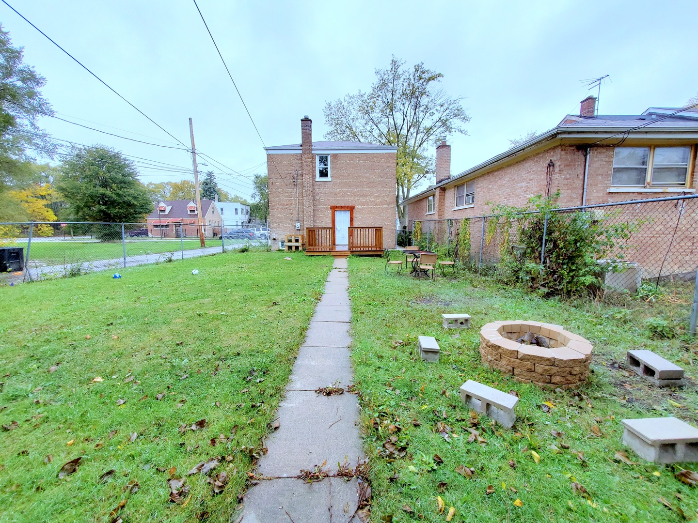 653 East 105th Street Chicago, IL 60628 - Photo 26 of 27 a view of a back yard of the house