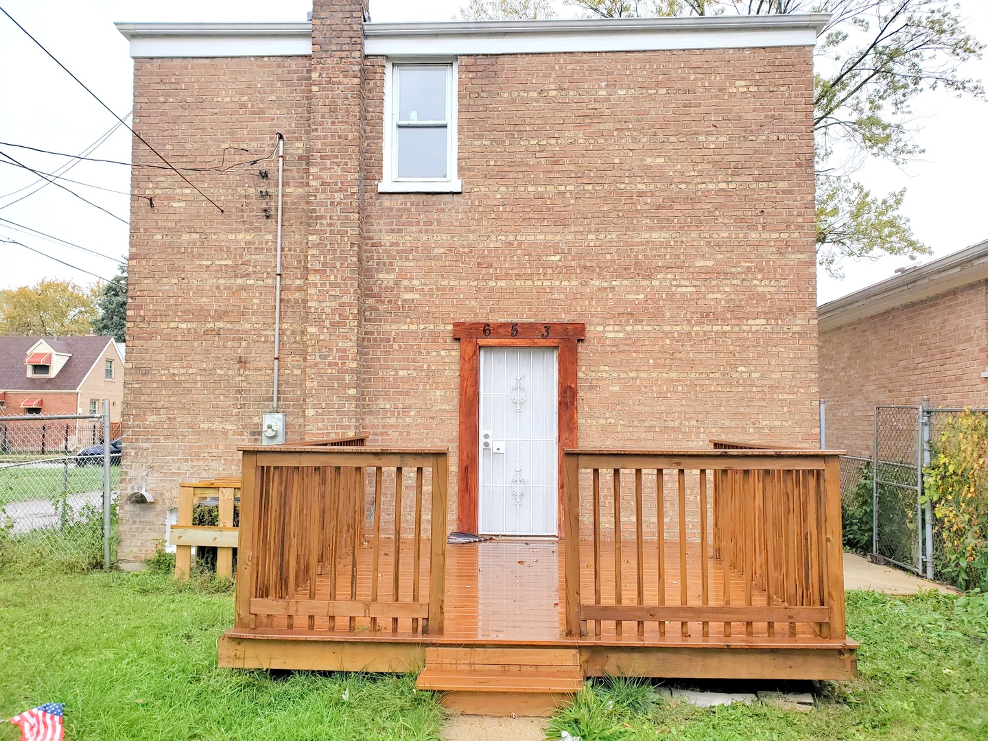 653 East 105th Street Chicago, IL 60628 - Photo 27 of 27 a view of a wooden door with a yard