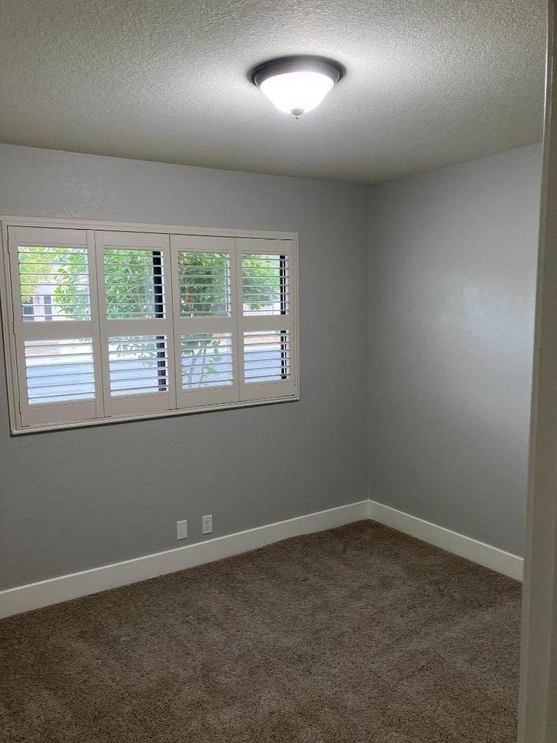 502 Oak Ridge Drive Roseville, CA 95661 - Photo 8 of 17 an empty room with a window