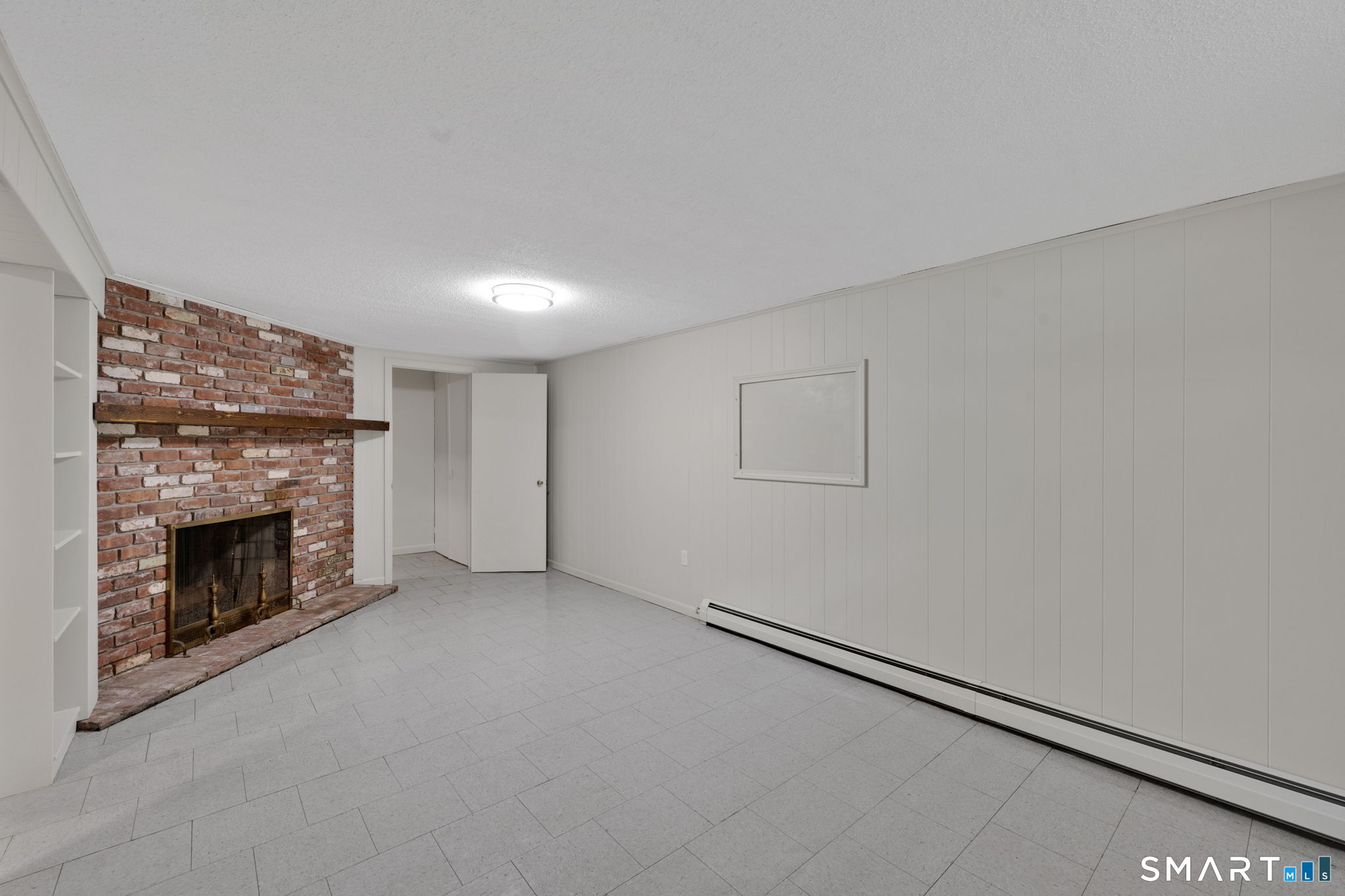 158 Notch Road Granby, CT 06035 - Photo 28 of 40 a view of empty room with a fireplace