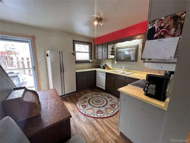 a kitchen with a stove a sink and a microwave