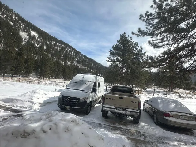 a bed room with furniture and lamp