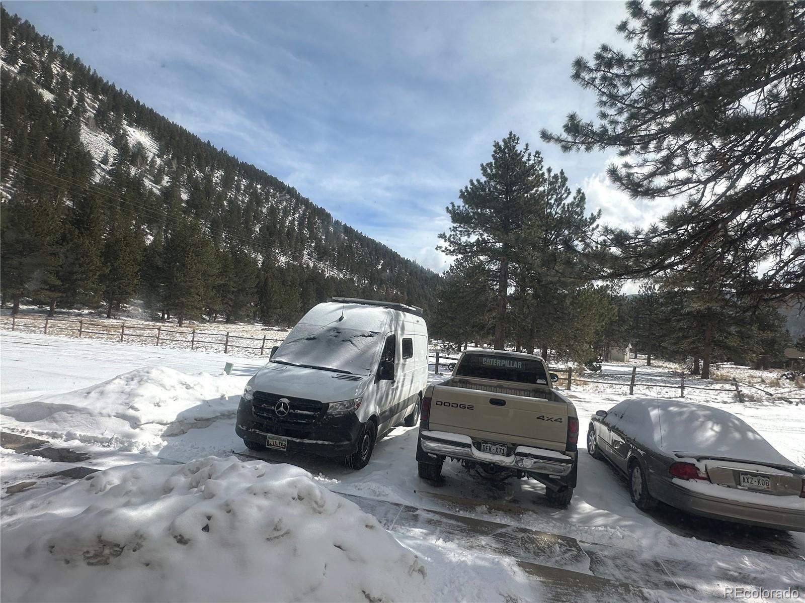95 Empire West Road, Unit DA 52 Empire, CO 80438 - Photo 8 of 32 a view of a car parked in a yard
