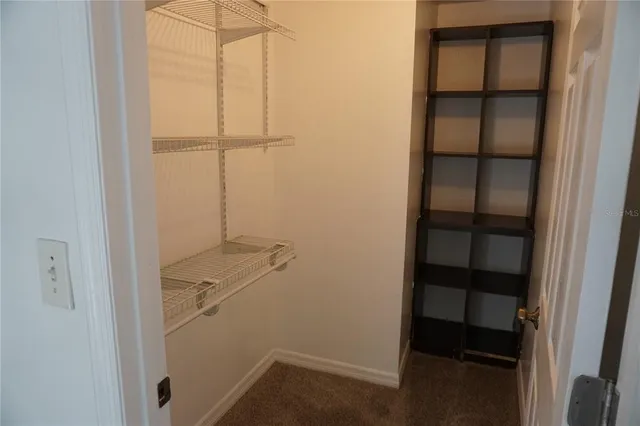 a bathroom with a toilet a sink and a mirror