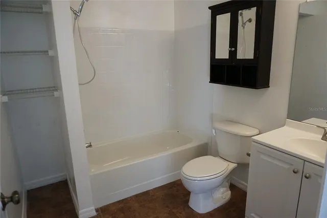 a view of a hallway with chandelier