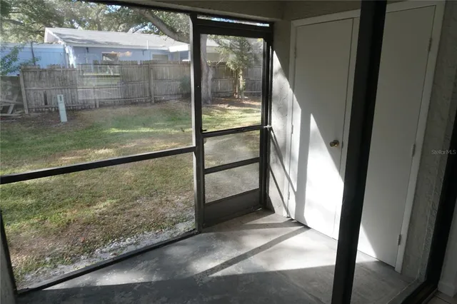 a view of a house with swimming pool and sitting area