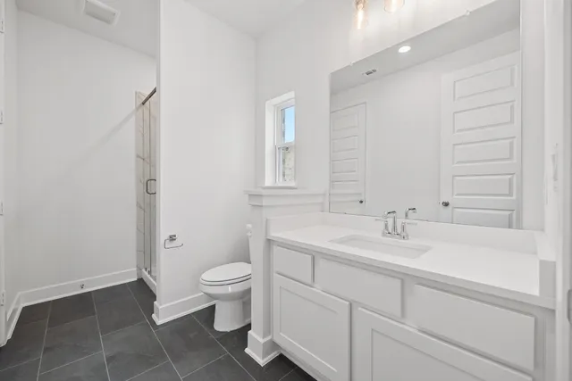 a bathroom with a sink toilet and vanity