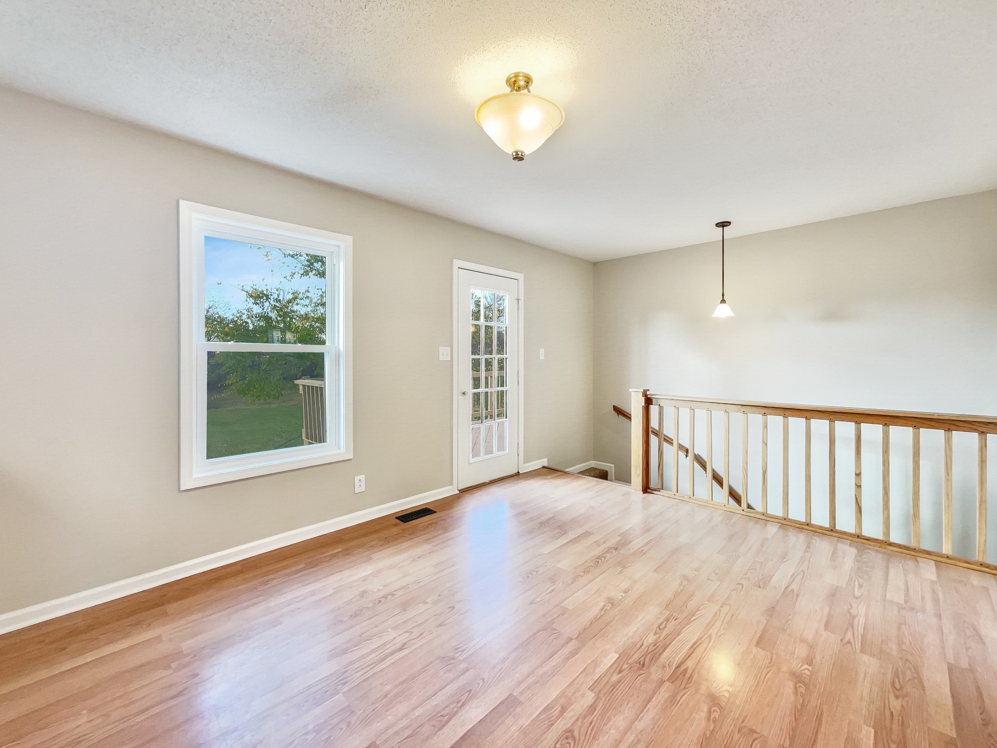 2222 Battle Creek Road Springfield, TN 37172 - Photo 5 of 17 a view of an empty room with a window and wooden floor