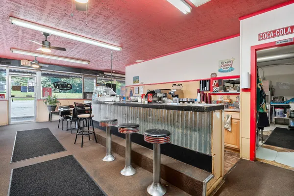 a living room with lots of furniture and a table