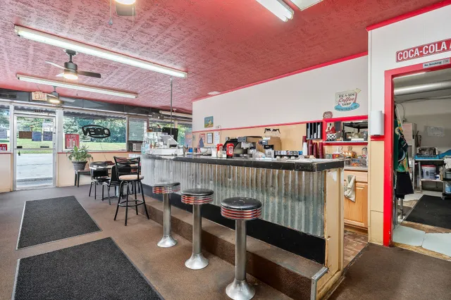 a living room with lots of furniture and a table