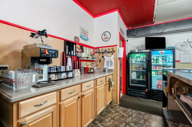 a kitchen with stainless steel appliances granite countertop a stove and cabinets