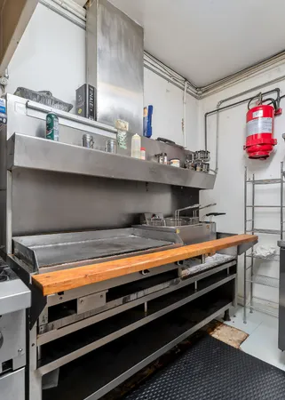 a view of kitchen with stainless steel appliances granite countertop a stove a sink and a microwave