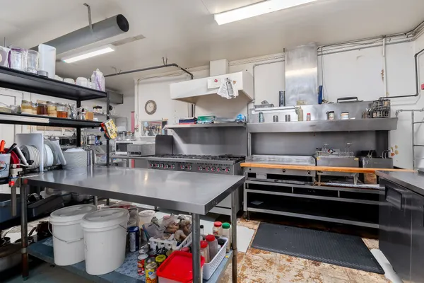 a kitchen with a stove and cabinets
