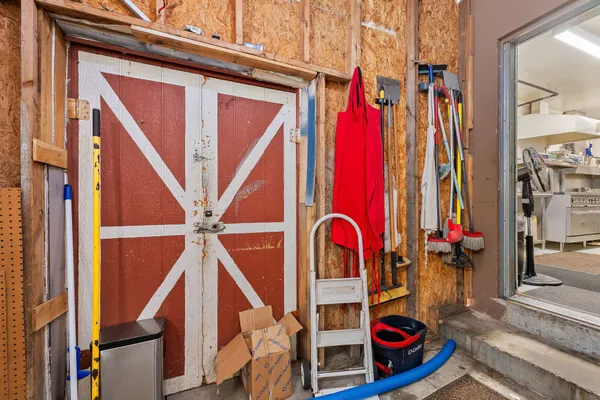a view of walk in closet with clothes
