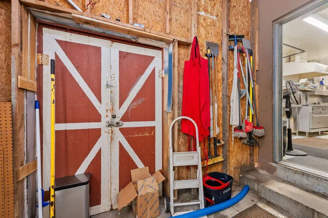 a view of walk in closet with clothes