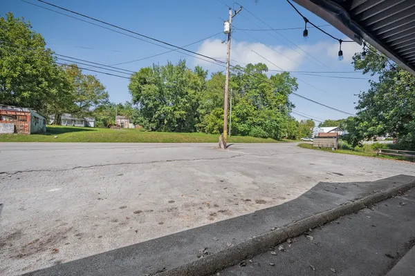a backyard of a house with lots of green space