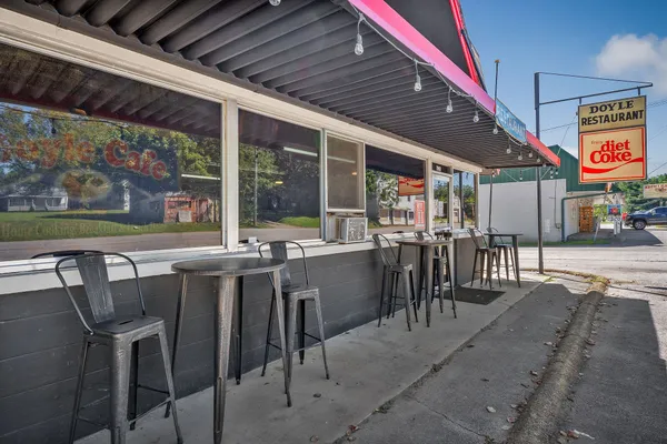 a view of a patio with table and chairs