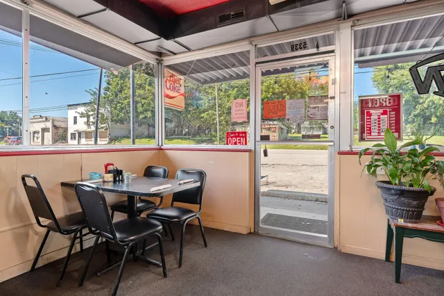 a outdoor dining space with furniture and garden view