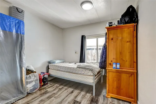 a room with bed and window